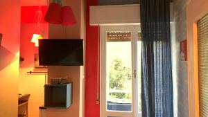 A television and/or entertainment centre at Domus LouLou