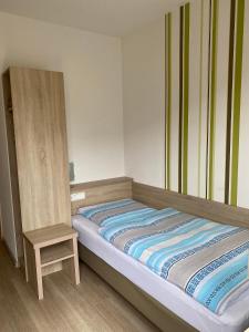 מיטה או מיטות בחדר ב-Gasthof Linde-Classico