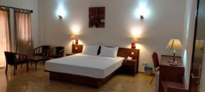 Postel nebo postele na pokoji v ubytování Hôtel Marbella