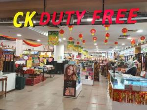 a cvs drugstore with a ck duty free sign in the aisle at Pangkor Coral Bay Resort(3 bedrooms) 休息小站 in Pangkor