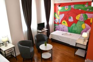 Postel nebo postele na pokoji v ubytování Osten Art Hotel