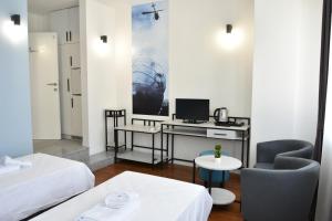 Postel nebo postele na pokoji v ubytování Osten Art Hotel