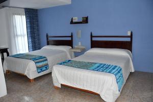 Postel nebo postele na pokoji v ubytování Hotel Posada Santa Fe