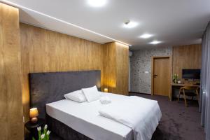 Säng eller sängar i ett rum på Hotel Novy Kastiel - Self check-in