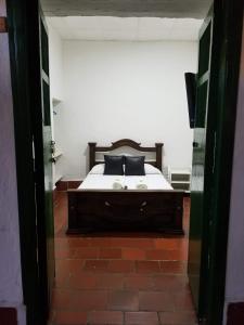 Ένα ή περισσότερα κρεβάτια σε δωμάτιο στο La Mansion Hostel