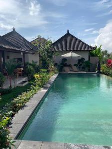 Bazén v ubytování Paraiso Cottage Ubud nebo v jeho okolí