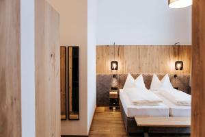 Ein Bett oder Betten in einem Zimmer der Unterkunft Hotel Thurnerhof