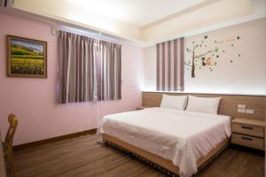 Llit o llits en una habitació de MuXia Fengqing Homestay