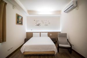 Llit o llits en una habitació de MuXia Fengqing Homestay