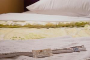 Cama o camas de una habitación en Hara Palace Hotel