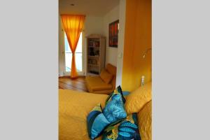 a bedroom with a bed and a living room at CASA UNA im Herzen von Bad Kreuznach in Bad Kreuznach