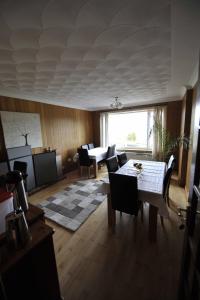 a living room filled with furniture and a window at Sandwick Bay Guest House in Stornoway