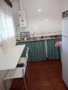 a kitchen with a sink and a counter top at Casa Marisa in Conil de la Frontera