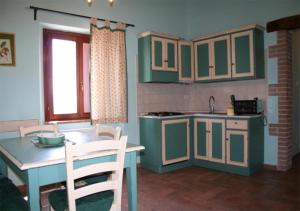 A kitchen or kitchenette at Borgo Di Fonni