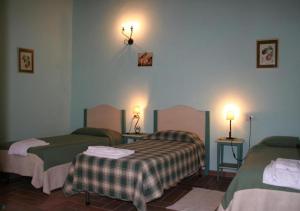 A bed or beds in a room at Borgo Di Fonni