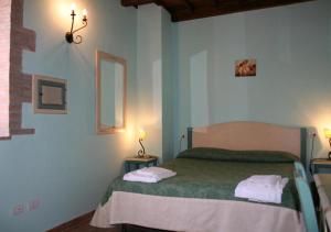 A bed or beds in a room at Borgo Di Fonni