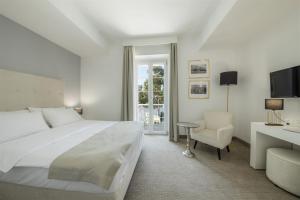 Postel nebo postele na pokoji v ubytování Aminess Younique Bellevue Hotel