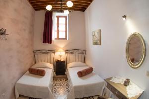 A bed or beds in a room at Villa Amalia