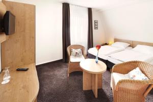Postel nebo postele na pokoji v ubytování Hotel Jensen