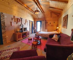 a living room with a couch and a bed at Ethno Homestay Savić in Vodice