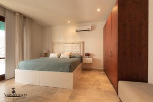 a bedroom with a bed in a room at Casa Virrey Eslava 120 inside the Walled City of Cartagena in Cartagena de Indias