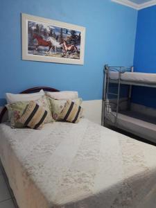 Un pat sau paturi într-o cameră la Alta Vista