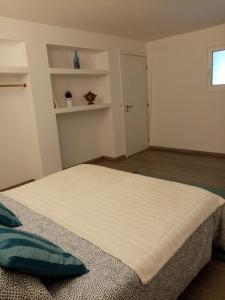 a bedroom with a large bed in a room at Casa do soito in Mangualde