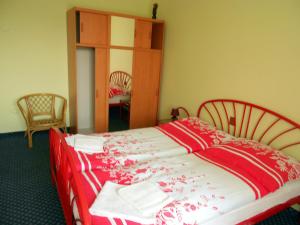 Postel nebo postele na pokoji v ubytování Penzion Paradise