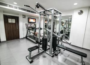 a gym with two tread machines in a room at Capitol Hill in Rānchī