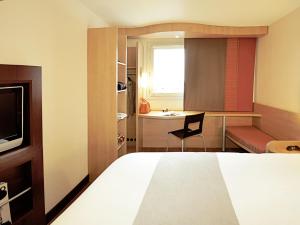 TV a/nebo společenská místnost v ubytování Hotel ibis Braga