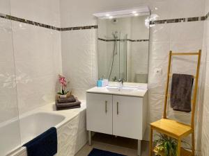 Ванная комната в Swann Disney Appartement