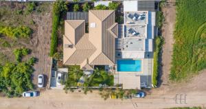 an overhead view of a building with a pool at Zimmer BaSadot in Yavneʼel