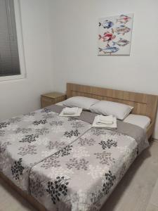 Postel nebo postele na pokoji v ubytování Villa Ivanovi