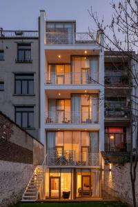 an apartment building with a staircase in front of it at Savoie in Brussels