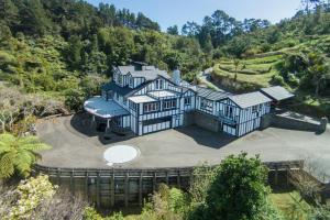 an aerial view of a large house on a hill at Woodroyd Estate holiday sanctuary in Island Bay