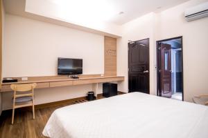 Televisor o centre d'entreteniment de MuXia Fengqing Homestay