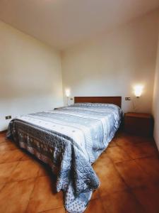 Postel nebo postele na pokoji v ubytování Comano Terme Apart
