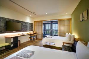 Postel nebo postele na pokoji v ubytování Shine Mood Resort Yuanli
