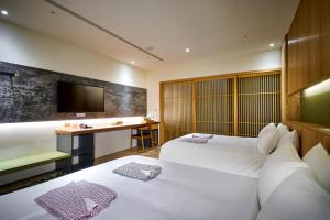Postel nebo postele na pokoji v ubytování Shine Mood Resort Yuanli