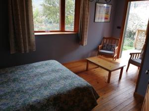 מיטה או מיטות בחדר ב-La casa verde