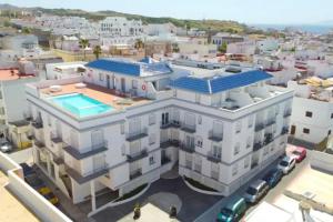 an aerial view of a building with a swimming pool at Ventum Suite in Tarifa