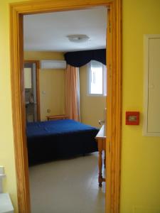 Postel nebo postele na pokoji v ubytování HOSTAL COSTA SOL