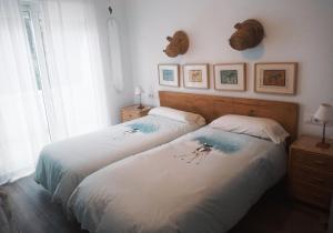 Postel nebo postele na pokoji v ubytování The Blue Family House
