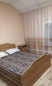 En eller flere senge i et værelse på Hotel Kuibyshevskaya