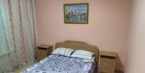En eller flere senge i et værelse på Hotel Kuibyshevskaya
