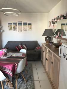 a living room with a couch and a table at Apartment Prado in Biarritz