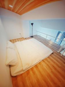 Uma cama ou camas num quarto em 埔里隱巷人文行旅民宿