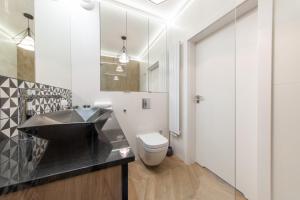 Kúpeľňa v ubytovaní VIP Apartamenty Butikowa