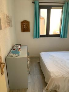 Postel nebo postele na pokoji v ubytování T2 bis terrasse PORT LEUCATE