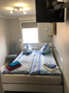 Postel nebo postele na pokoji v ubytování Motel Home Berlin